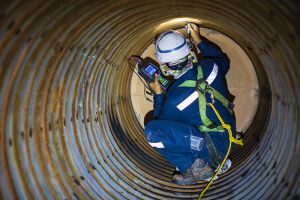 Male worker in confined space